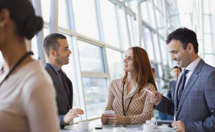 Business people exchanging business cards at conference