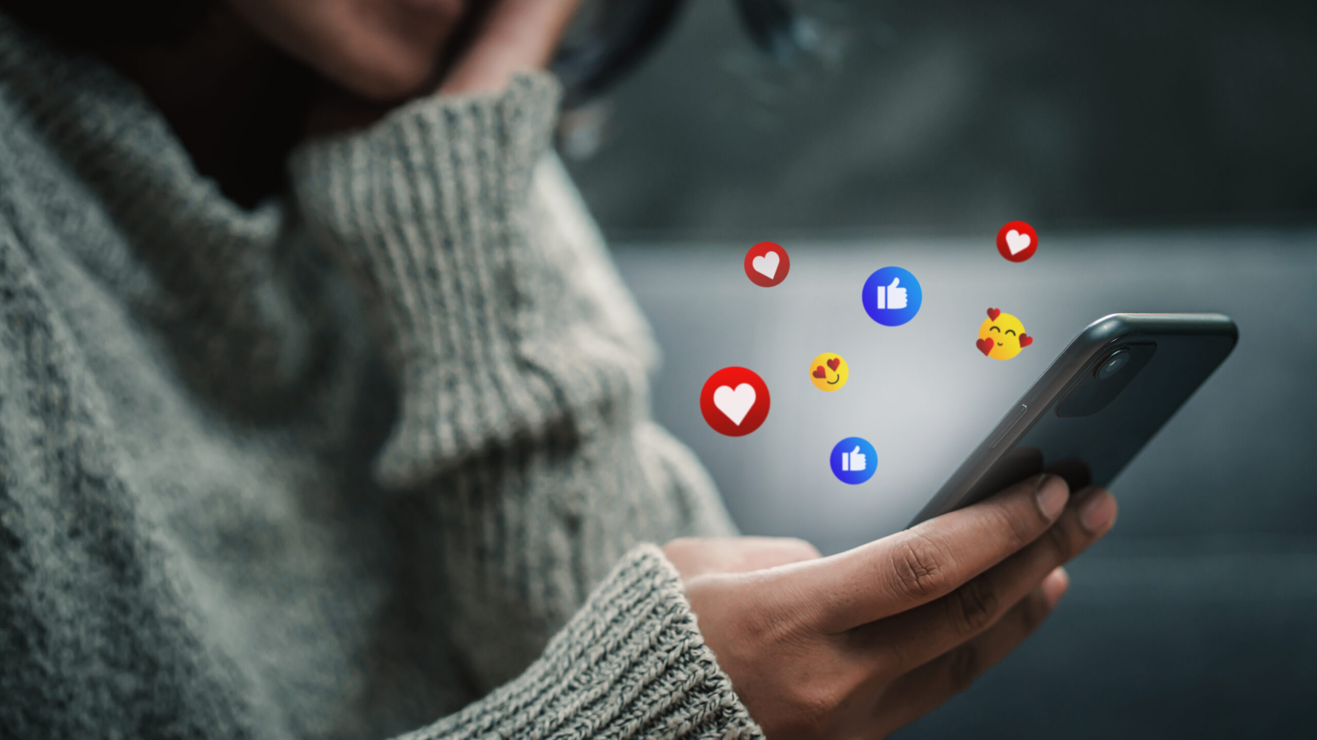 Happy woman looking on smartphone watching social and online ent