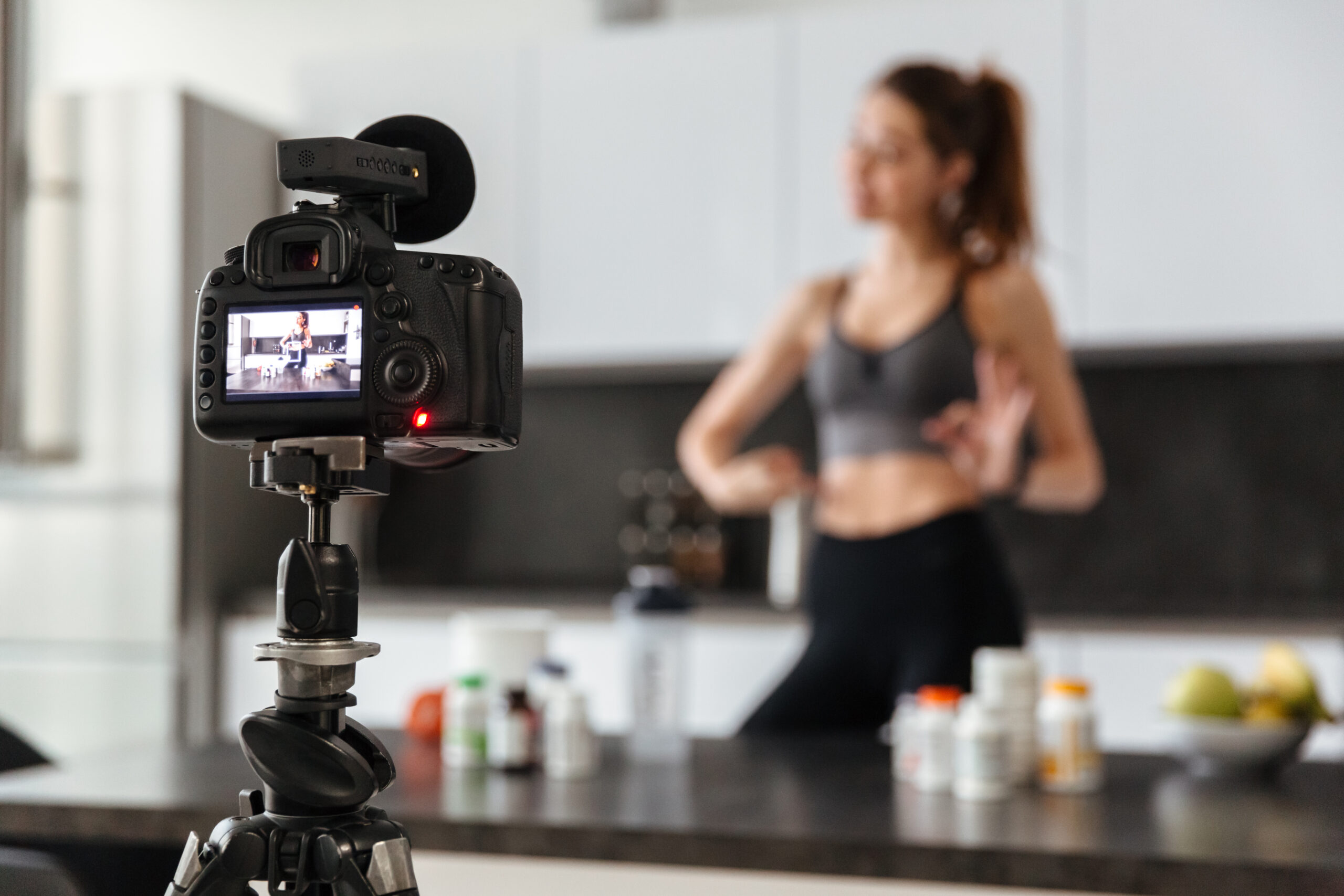 Happy healthy young girl recording her video blog episode
