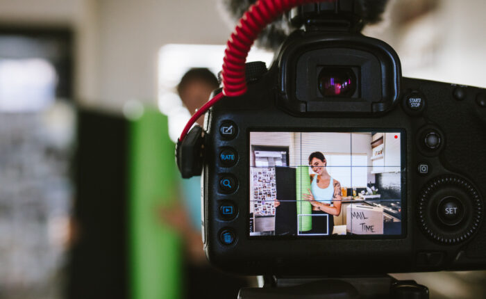 Female vlogger reviewing a yoga mat