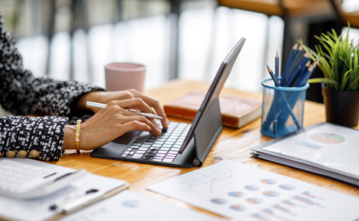Businesswoman working at office with documents on his desk, doin